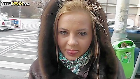 Horny blonde in sexy stockings takes off her clothes