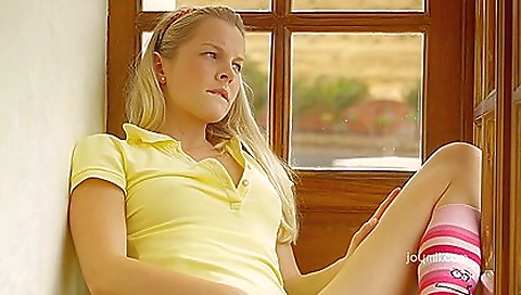 Blonde beauty with a petite body shows off her perfect figure