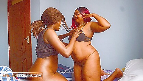 Ebony redhead and ebony blonde are having lesbian sex