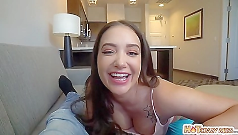 Big ass brunette babe with big natural tits is on the couch