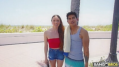 Busty redheaded brunette with a shaved pussy gets spanked