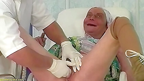 German granny with long hair gets her pussy fisted