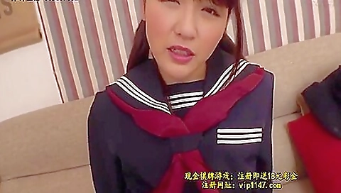 Japanese teen is playing with a big black toy and her mouth