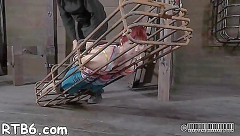 Redhead slave fucked in a strange manner in hardcore