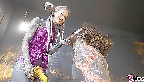 Busty brunette and her friend are playing with a dildo